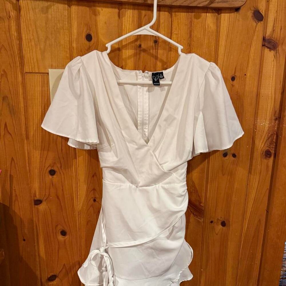 White romper with ruffle detail